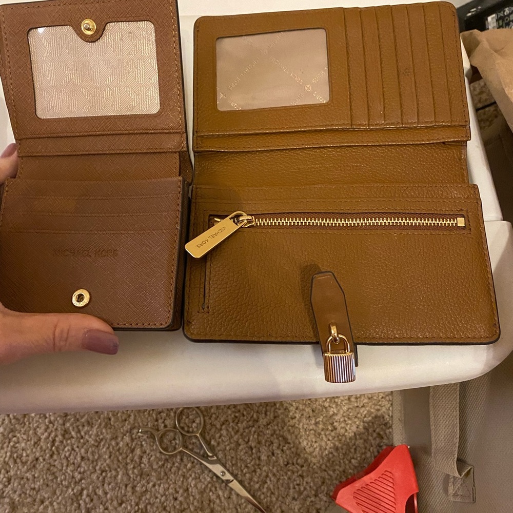 Two Michael Kors wallets